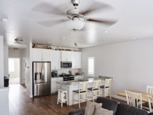 professional electric inc ceiling fan installation above open concept kitchen and dining room